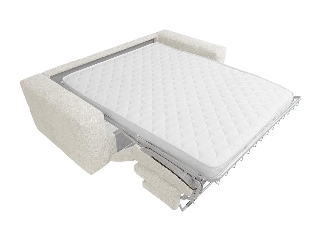 Canapé Issoro ouvert en lit, matelas blanc matelassé déplié sur une armature métallique chromée.