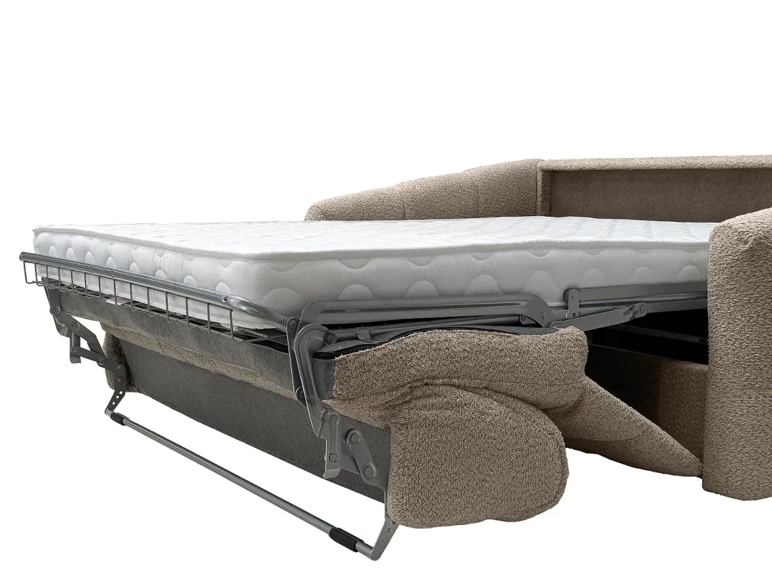 Canapé Retuna ouvert en lit, matelas blanc déplié sur un sommier métallique à lattes apparentes.